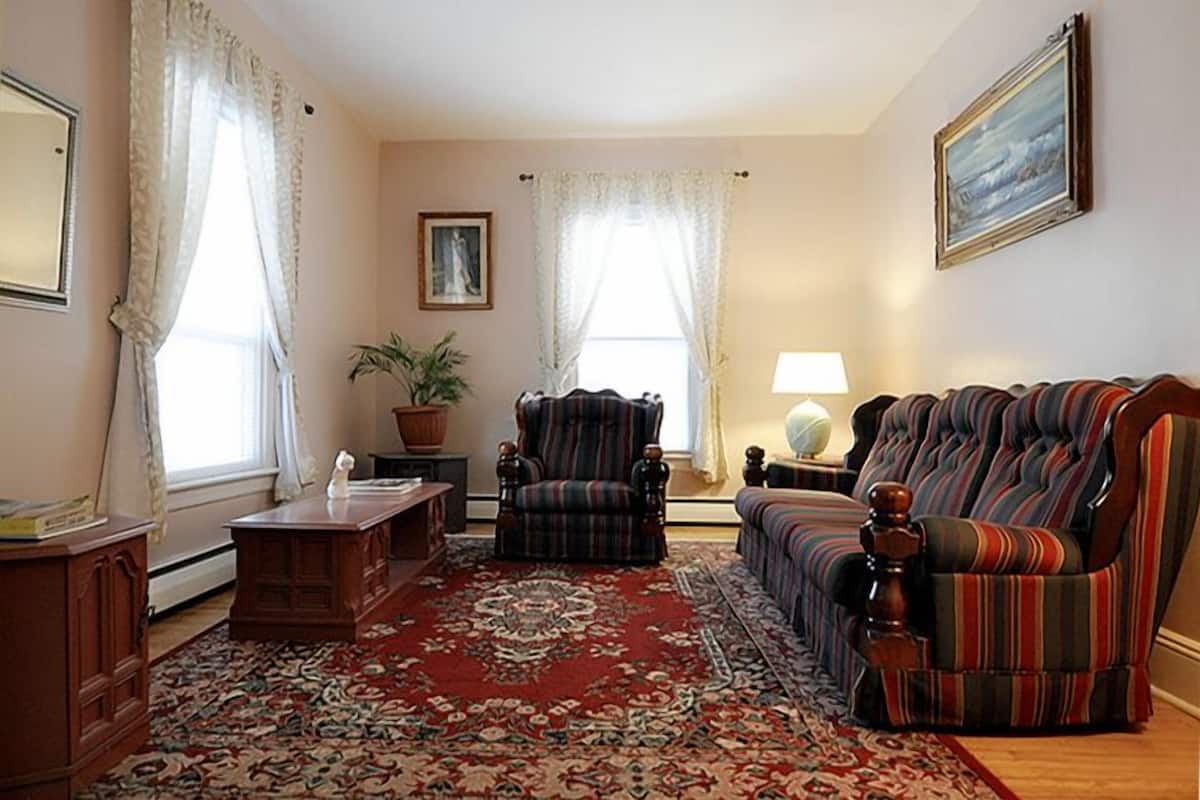 family suite, 2 bedrooms | living area | flat-screen tv