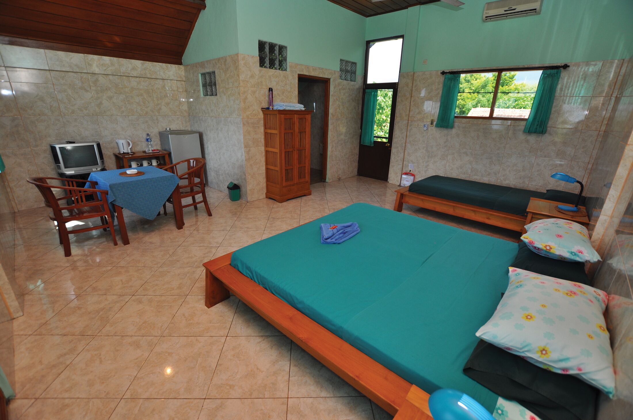 superior room, 1 bedroom, partial ocean view, garden area | in-room safe, laptop workspace, bed sheets