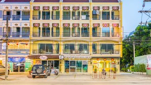 A multi-story building with a dental clinic on the ground floor.