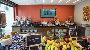 A hotel breakfast area with a variety of food options, including fruits, pastries, and beverages. - Citea Apart-Hotel (Beirut)
