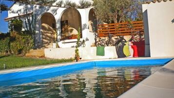 Seasonal outdoor pool, pool umbrellas, pool loungers