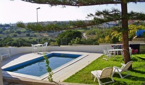 Seasonal outdoor pool, pool umbrellas, pool loungers