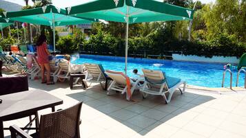 Seasonal outdoor pool, open 10 AM to 6 PM, free pool cabanas