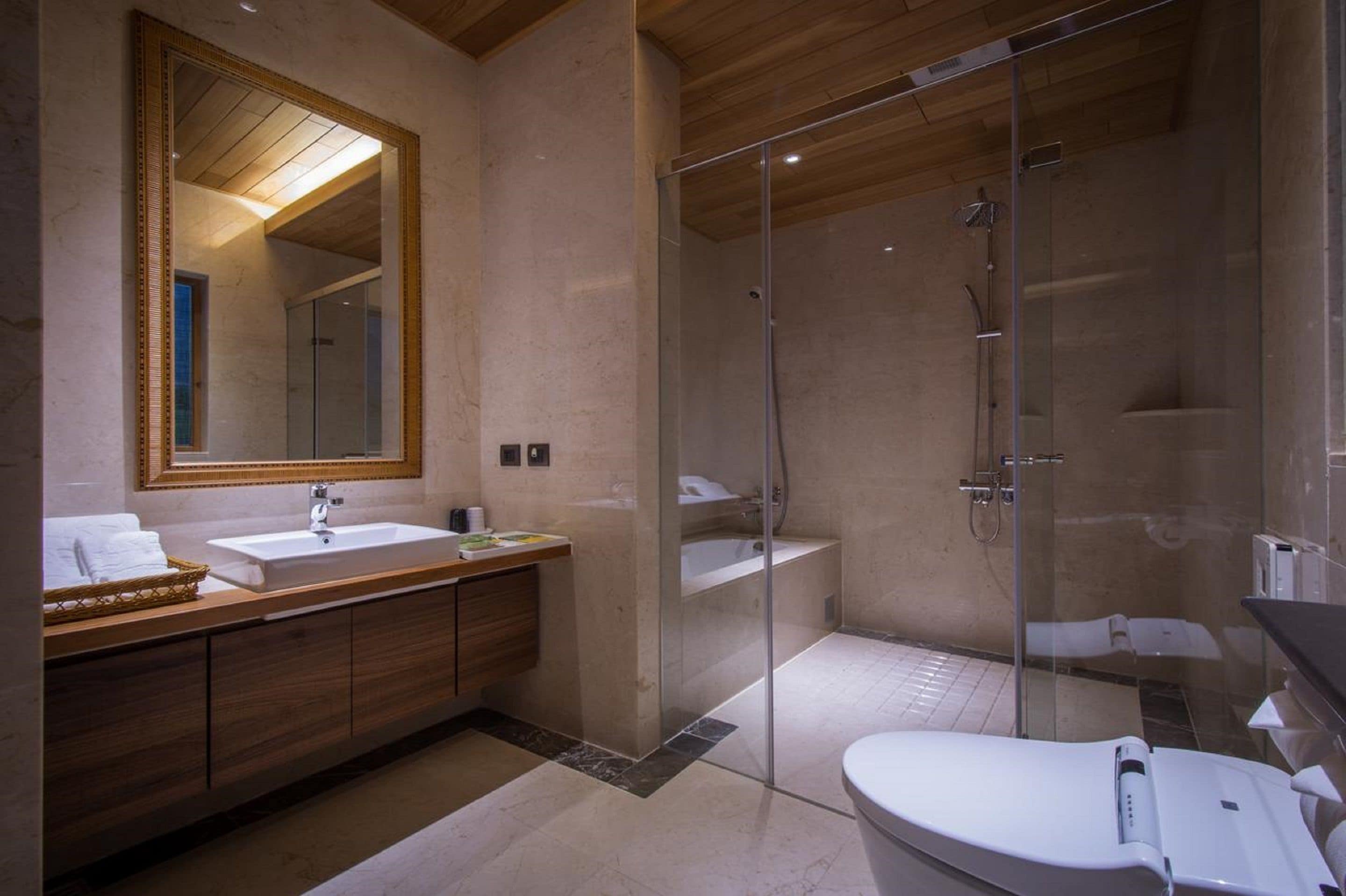 deluxe double room | bathroom | shower, hair dryer, slippers, bidet