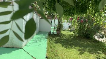 Triple Room, Garden View | Terrace/patio