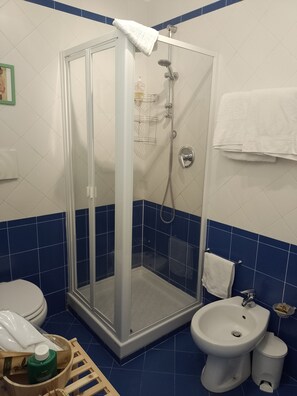 Shower, free toiletries, hair dryer, slippers