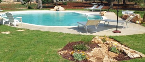 Seasonal outdoor pool, pool loungers