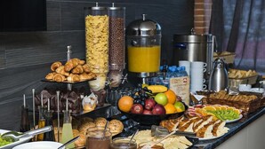 A buffet with various food items, including fruits, pastries, and condiments. - Tbilisi Inn (Tbilisi)