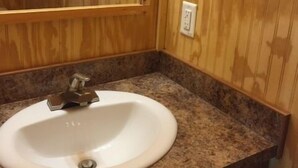 Family Cabin | Bathroom sink - RV Resort At Carolina Crossroads (Roanoke Rapids)