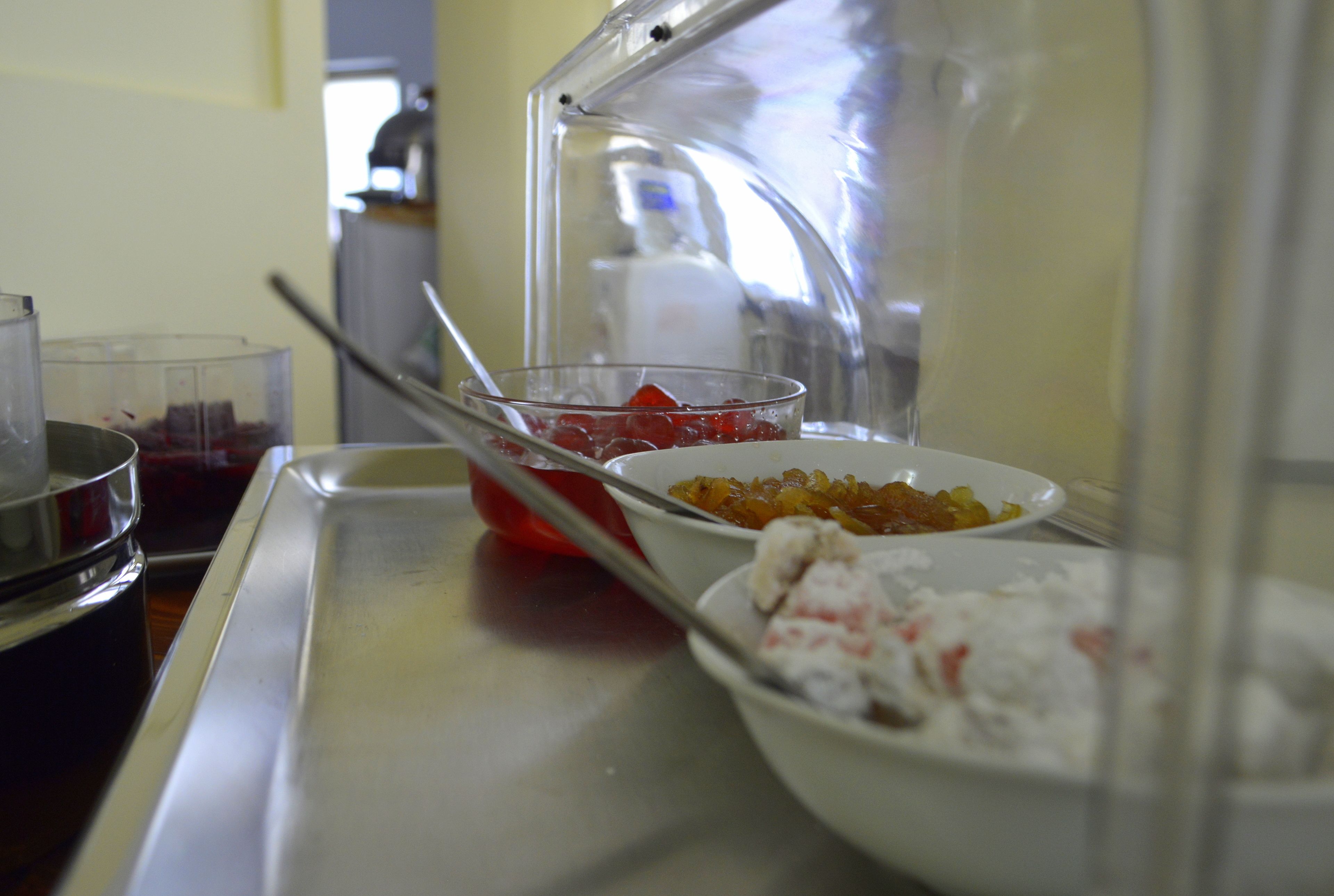 A kitchen counter with various food items and a blender.
