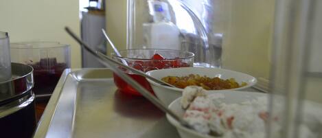 A kitchen counter with various food items and a blender.
