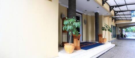 A hotel entrance with a sign reading "KENICANA BALLROOM".