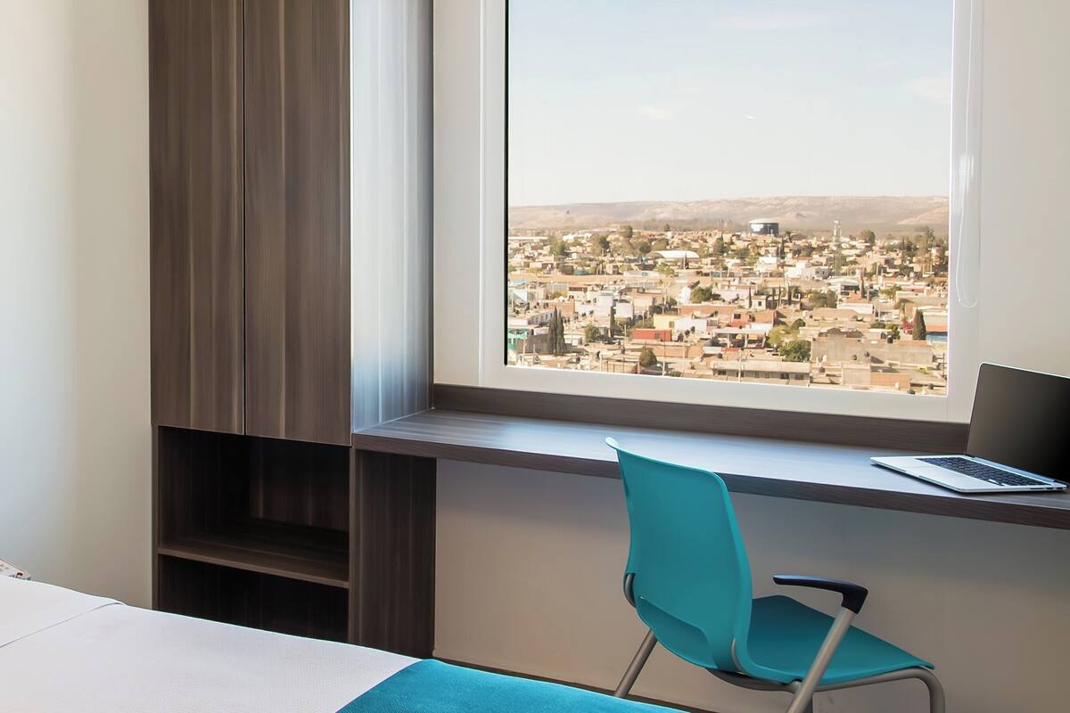 hypo-allergenic bedding, down duvets, in-room safe, desk