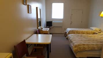 Standard Room, 2 Queen Beds | Living area | 32-inch flat-screen TV with cable channels, TV