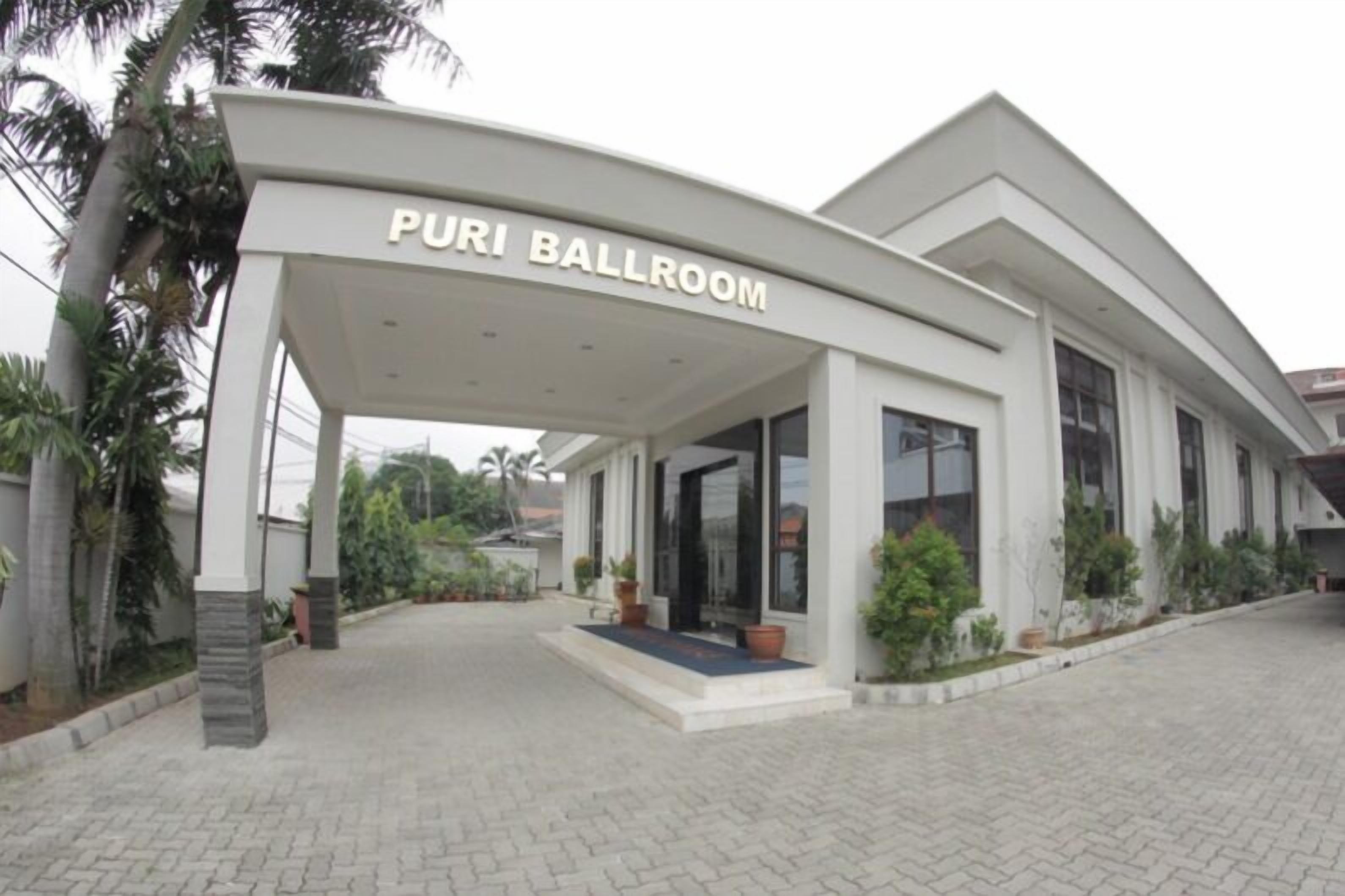 A modern building with a sign reading "PURI BALLROOM".