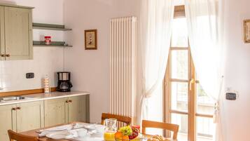Apartment, 1 Bedroom | Living room | Flat-screen TV