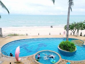A pool area with a view of the beach and ocean. - Talkoo Beach Resort Khanom (Khanom)