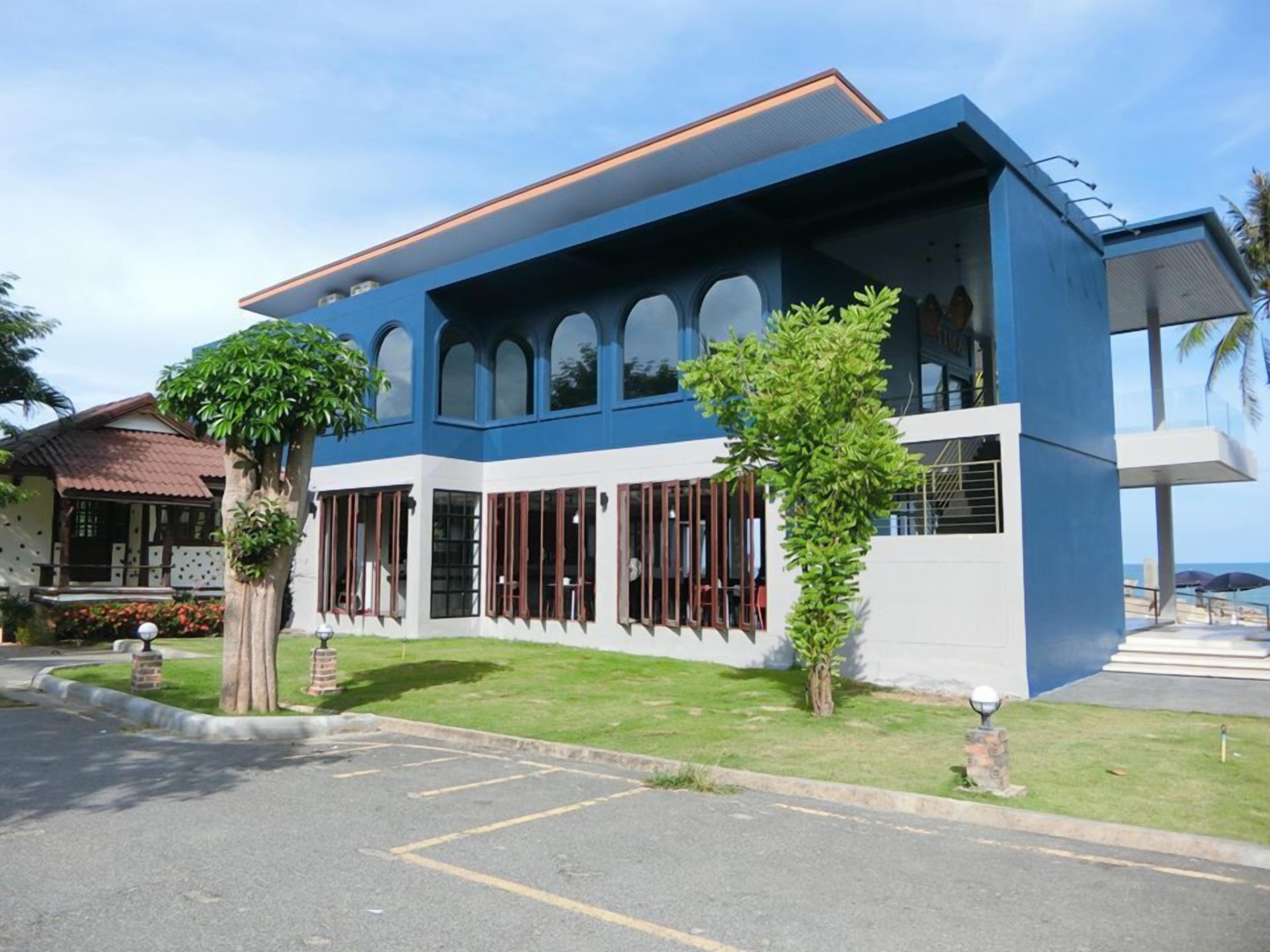 A modern building with large windows and a flat roof.