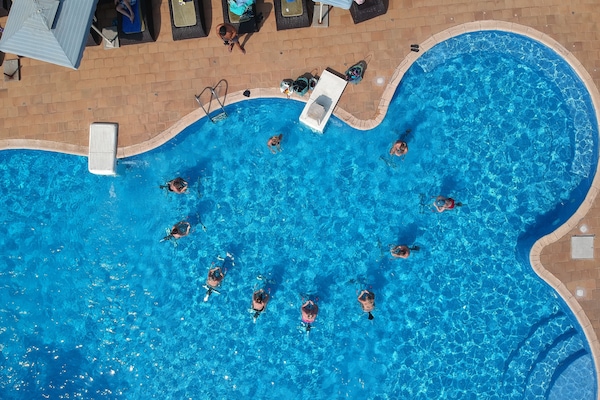 Outdoor pool, pool umbrellas, sun loungers