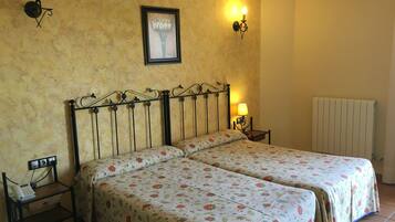 Standard Double Room | Minibar, in-room safe, desk, blackout drapes