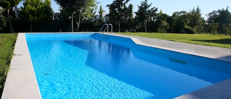 Outdoor pool, pool umbrellas, pool loungers