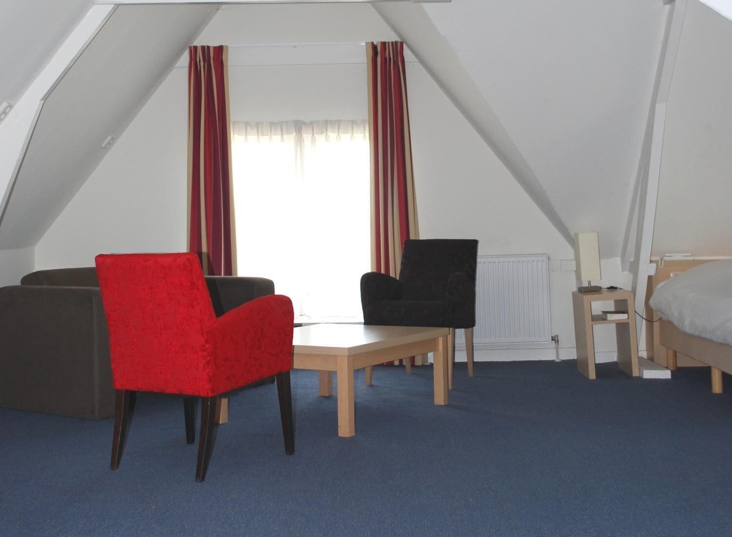 Quadruple Room | Living room | Flat-screen TV