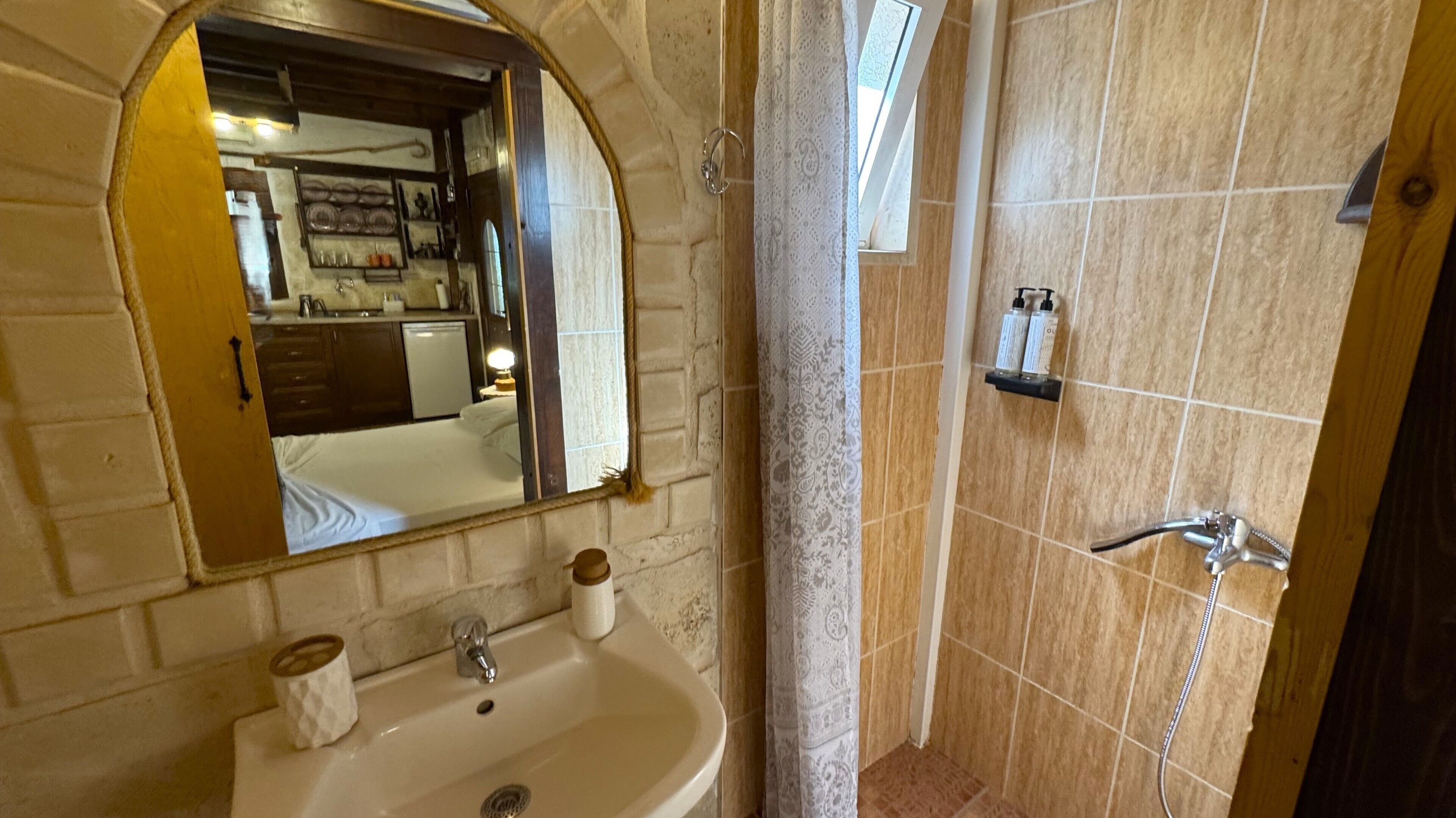 shower, rainfall showerhead, hair dryer, towels