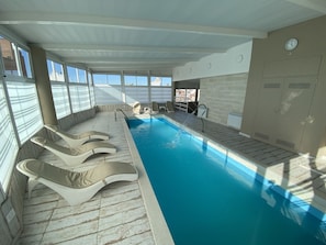 Indoor pool, outdoor pool, open 9:00 AM to 8:00 PM, pool loungers