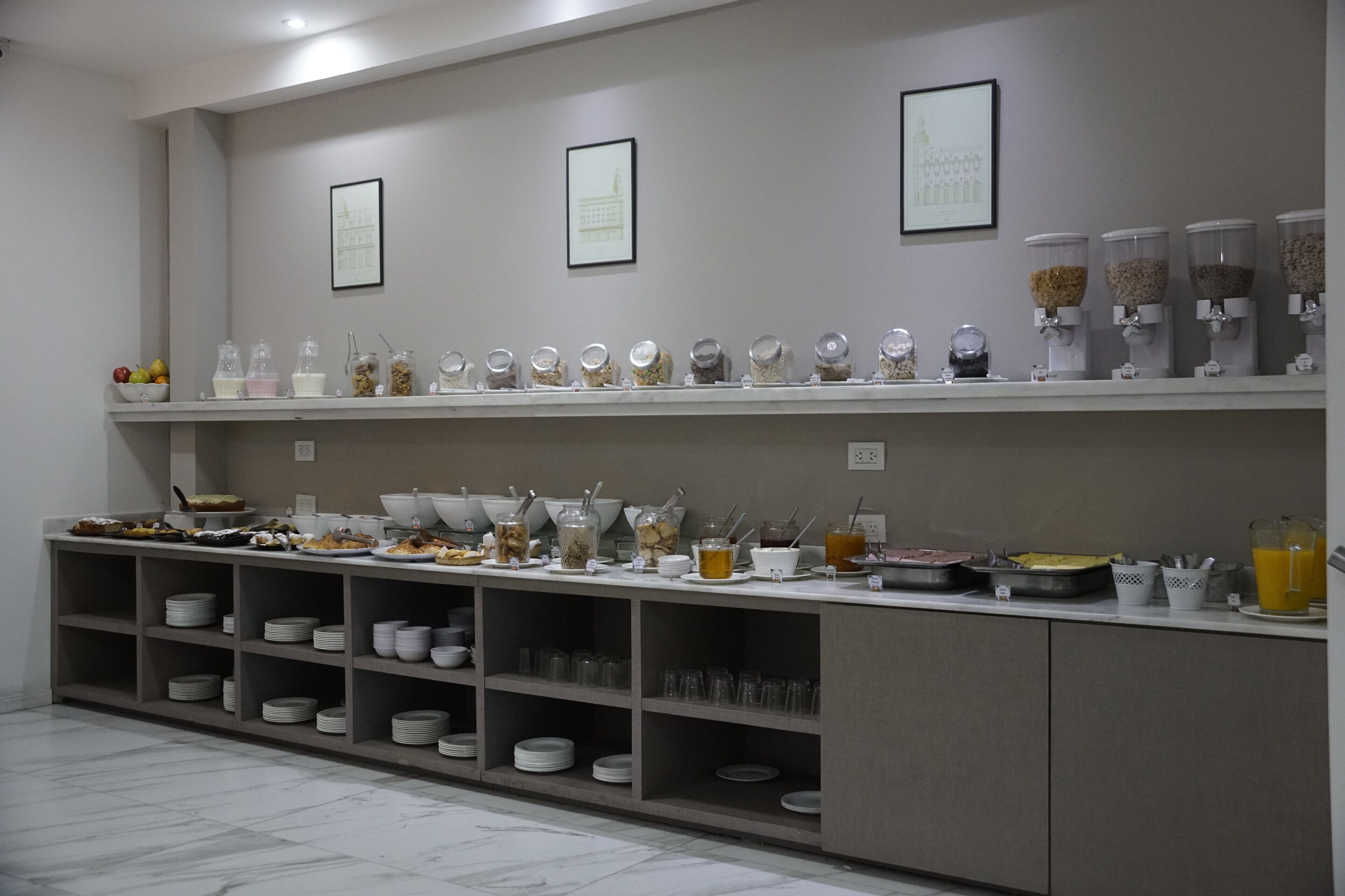 A buffet setup with various food items and beverages.