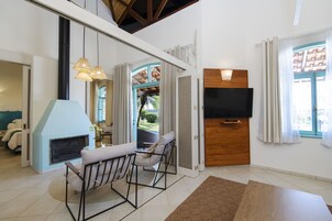 Premium Loft | Living area | 32-inch LCD TV with cable channels, TV, Netflix