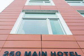 The 250 Main Hotel features a modern architectural design with a large facade and prominent signage.