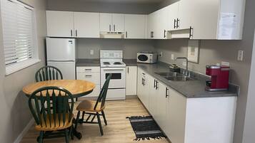 Full-size fridge, microwave, coffee/tea maker, electric kettle