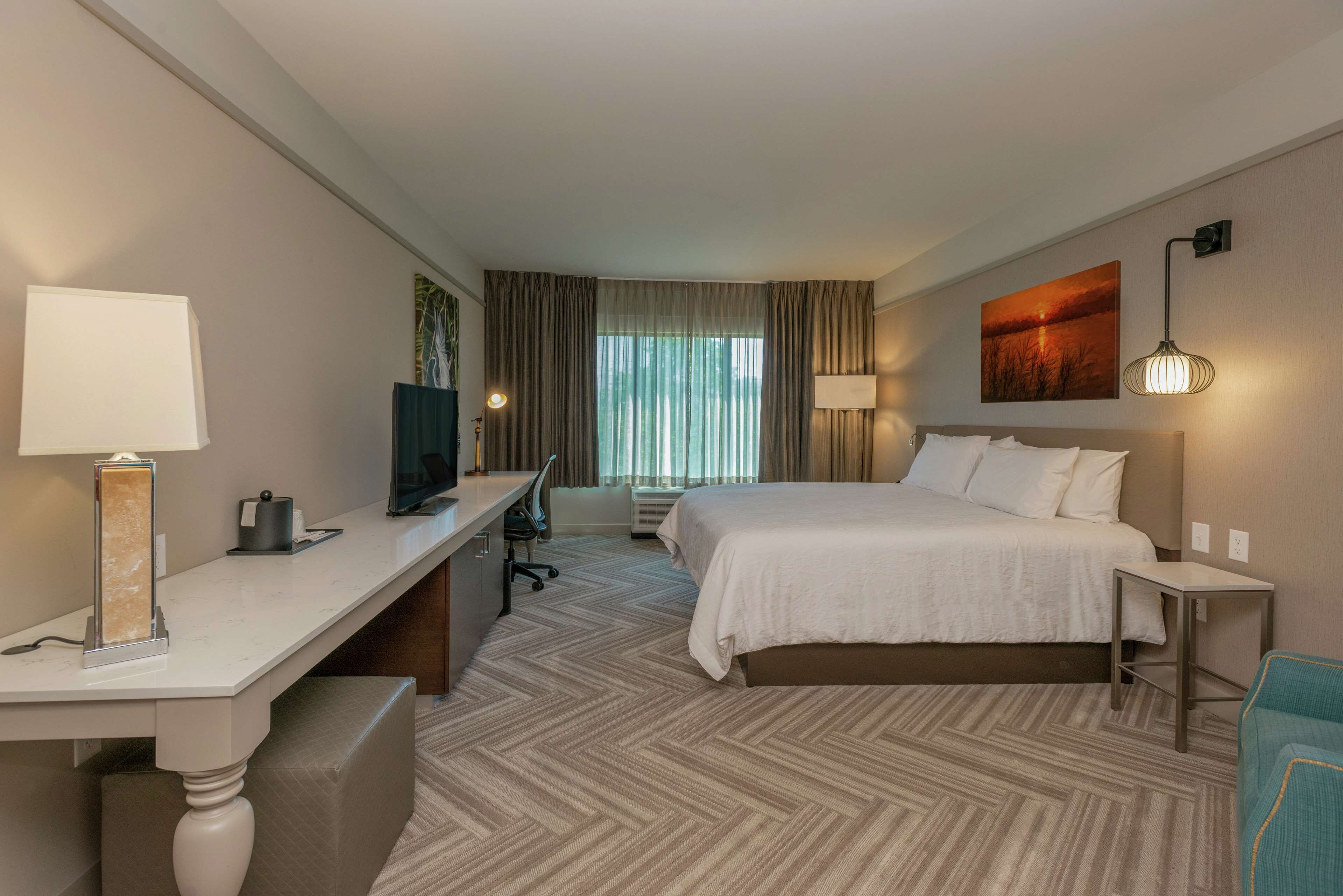 Premium bedding, desk, laptop workspace, iron/ironing board