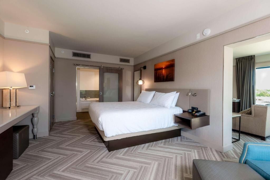 Premium bedding, desk, laptop workspace, iron/ironing board