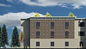 A hotel with a stone facade, multiple balconies, and a central entrance. - Candlewood Suites Lakeville I-35 by IHG (Lakeville)