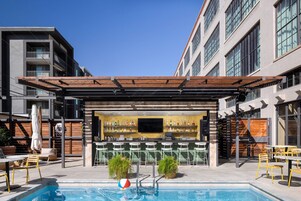 Outdoor pool, open 9:00 AM to 10:00 PM, pool umbrellas, sun loungers