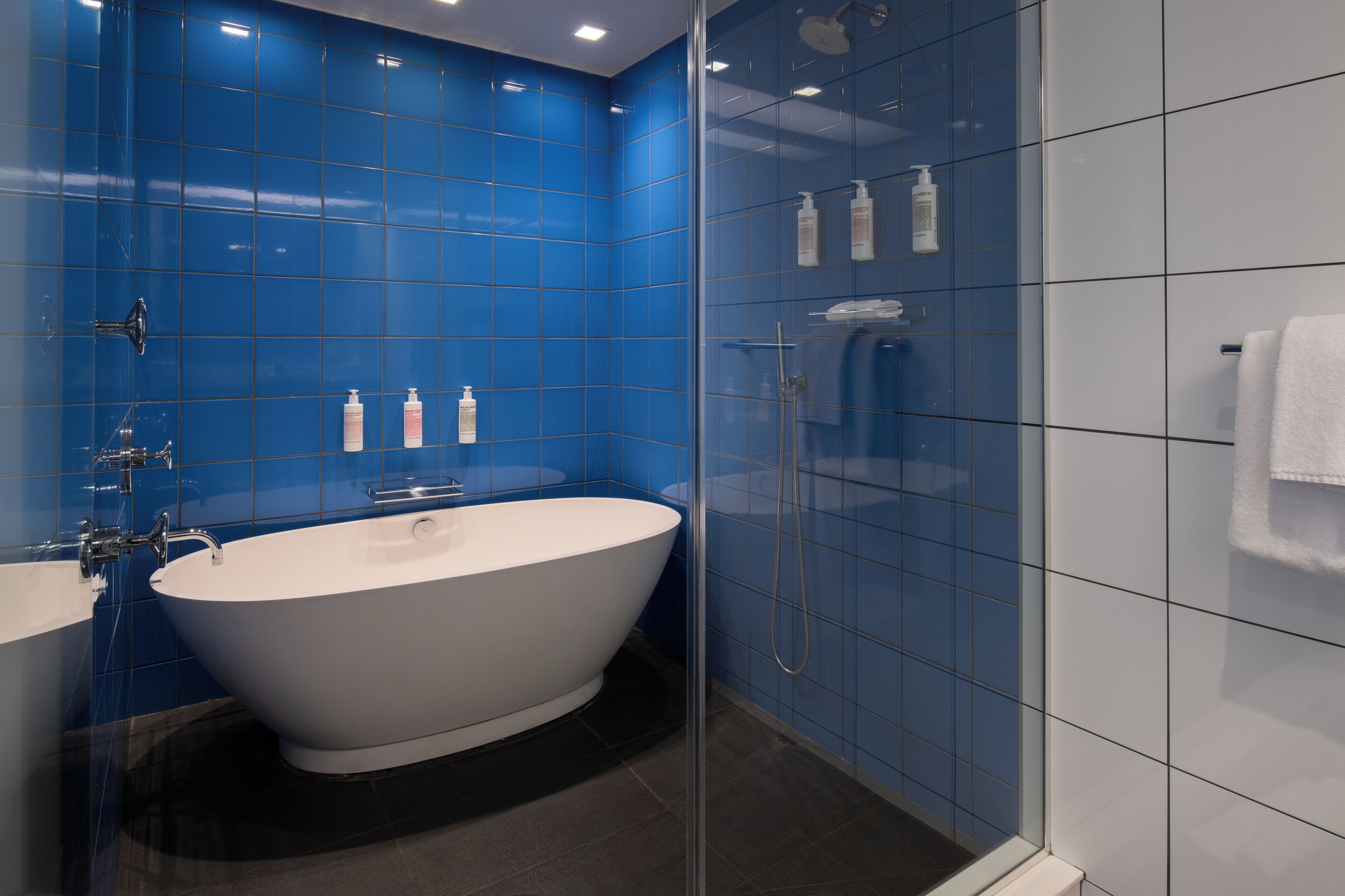 rainfall showerhead, designer toiletries, hair dryer, bathrobes