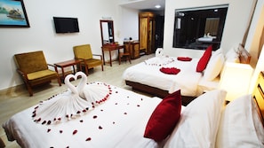 A hotel room with two beds, a TV, a desk, and a chair. - Dinata Angkor Boutique Hotel (Siem Reap)