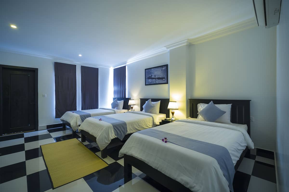 Deluxe Triple Room, Pool View | Minibar, in-room safe, desk, iron/ironing board (on request)