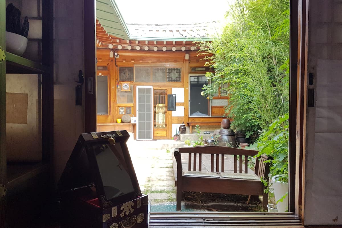 A traditional Japanese building with a wooden exterior and a tiled roof.