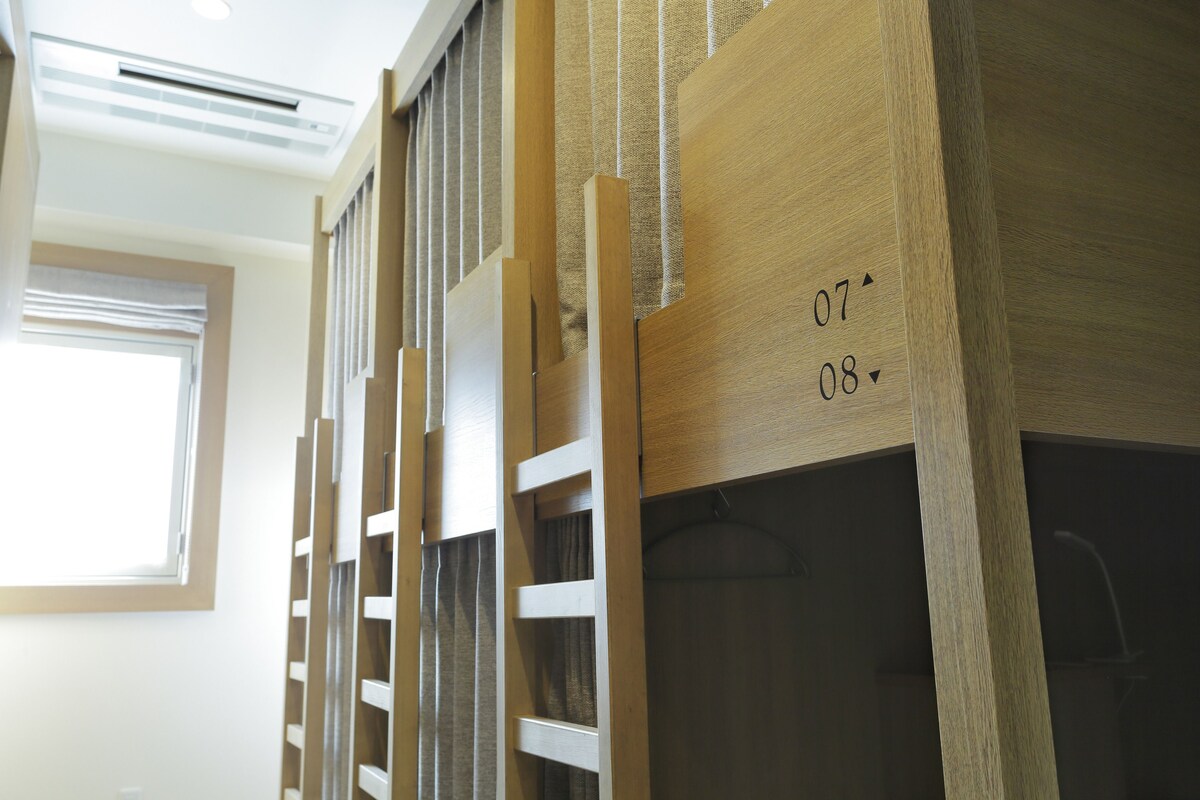 A wooden wardrobe with a number '07' and '08' visible, indicating room numbers.