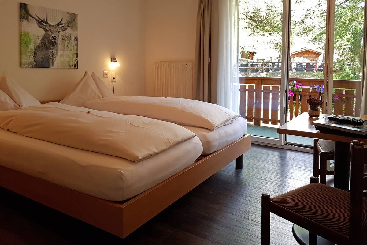 double room (cosy) | in-room safe, desk, free cots/infant beds, rollaway beds