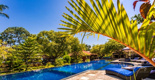 2 outdoor pools, pool umbrellas, pool loungers