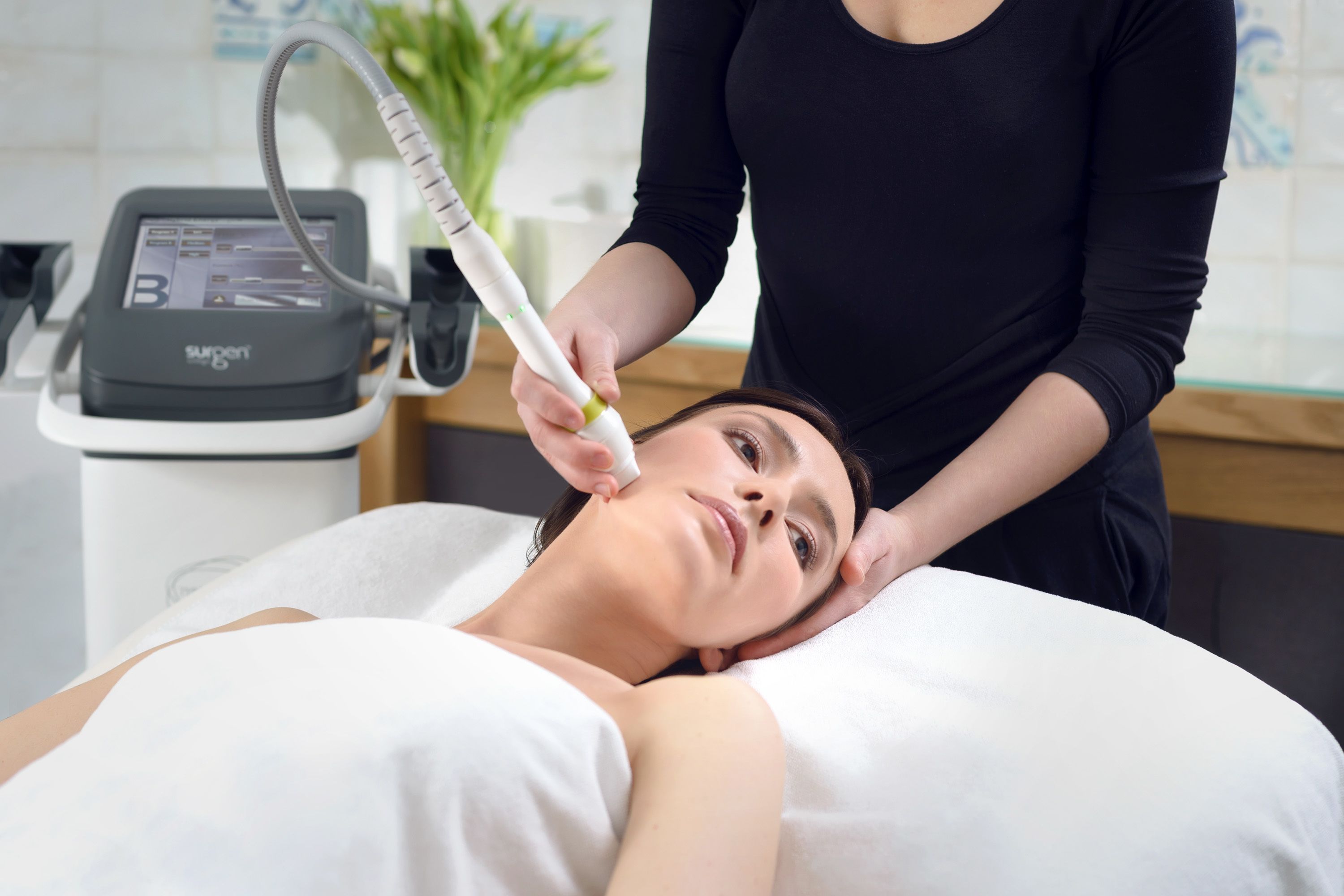 A medical device being used on a patient in a clinical setting.