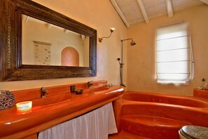 A bathroom with a large mirror, two sinks, a bathtub, and a shower. - Vouliagmeni Villa (Vari-Voula-Vouliagmeni)