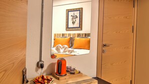 A compact kitchenette with a small fridge, a kettle, and a coffee maker. - Vavien Hotel (Istanbul)