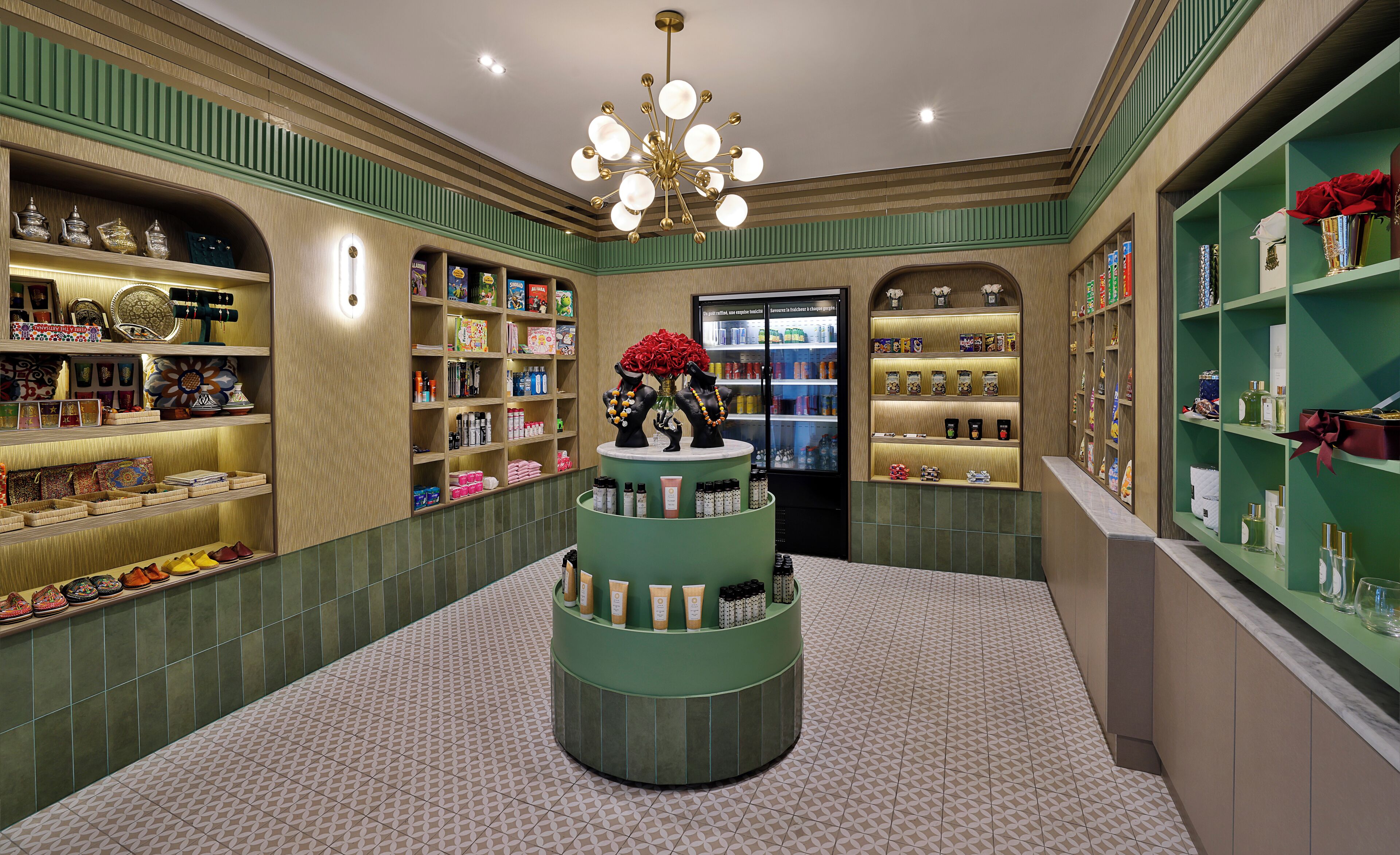 A luxury boutique with a central display of cosmetics, surrounded by shelves of perfumes and toiletries.