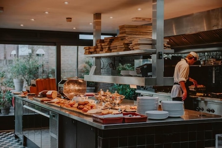 Daily buffet breakfast for a fee. Boutique Hotels MANNA & Blue