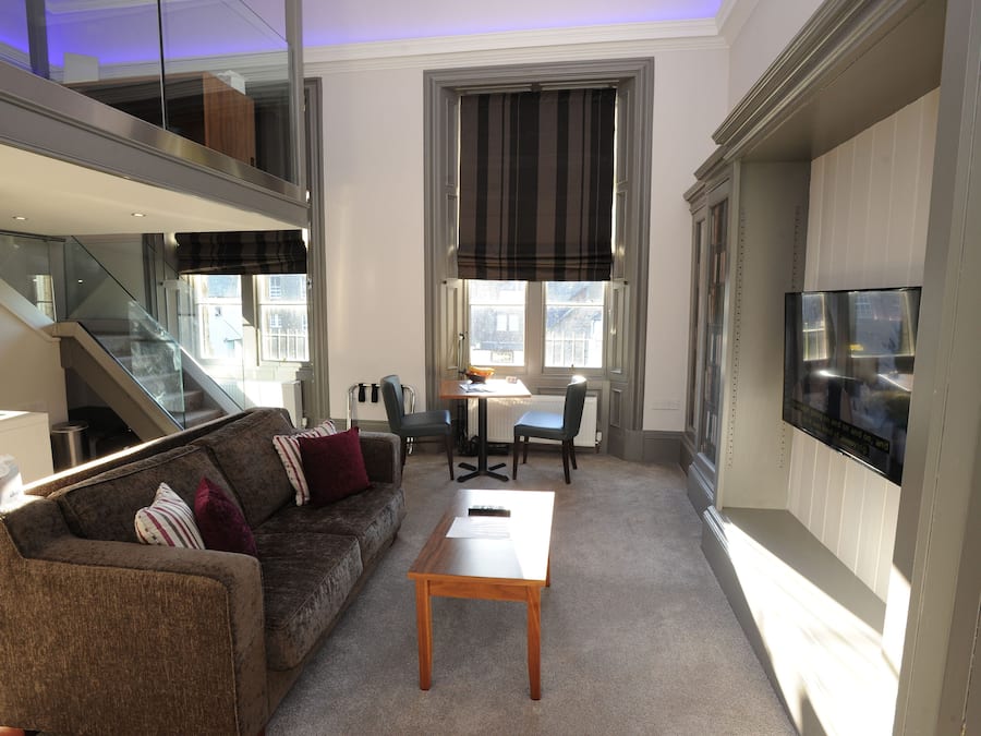 Deluxe Suite, 1 Bedroom (Duplex - Sofa bed for 3 only) | Living room | Flat-screen TV