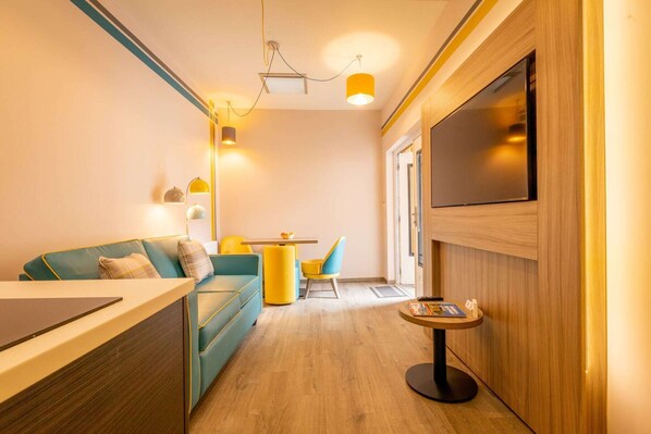 Studio, Courtyard Area (Split Level, 2nd bed by arrangement) | Living area | Flat-screen TV